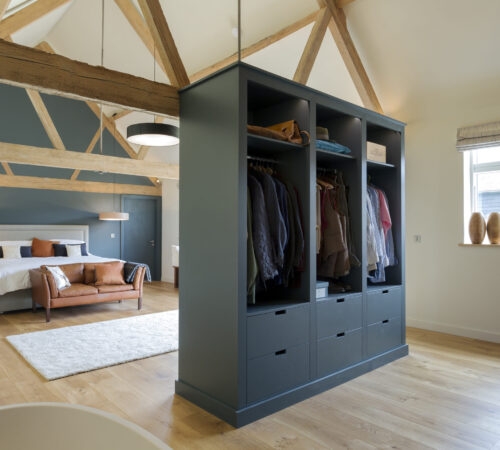 Wardrobe and bed in modern bedroom